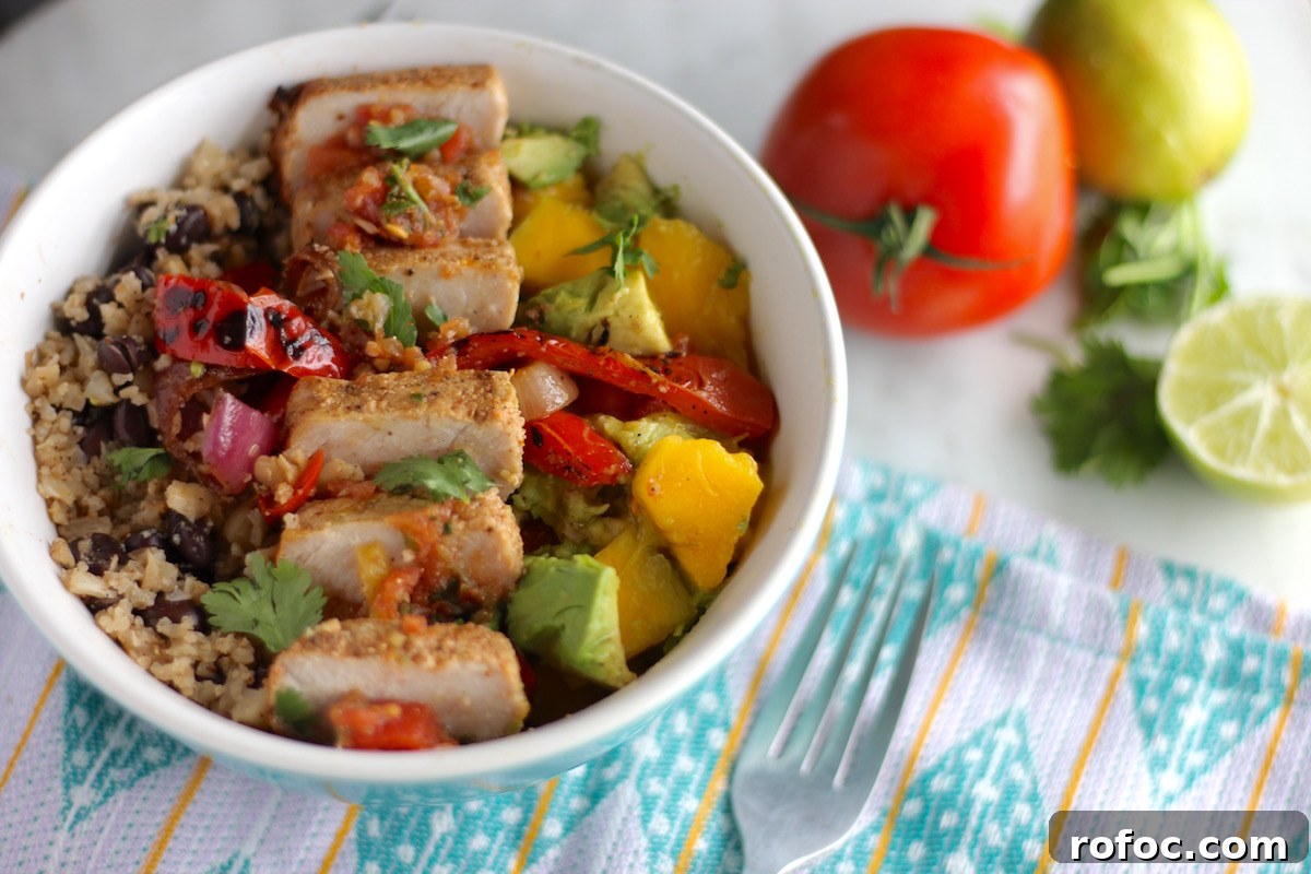 Grilled Pork Burrito Bowls with Cilantro Lime Rice and Salsa 12 Grilled Pork Burrito Bowls - loaded paleo-friendly rice bowls are topped with grilled marinated pork, spicy fresh salsa, mango guacamole, and charred peppers and onions! | fedandfulfilled.com