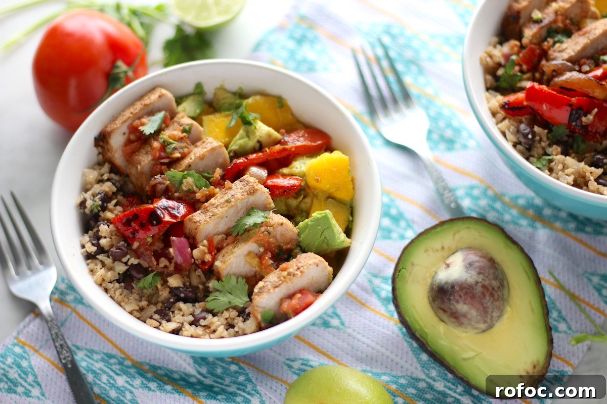 Grilled Pork Burrito Bowls with Cilantro Lime Rice and Salsa 3 Grilled Pork Burrito Bowls - a crazy delicious bowl of grilled pork ribs, charred peppers and onions, cauliflower rice and beans, mango guac, and fresh salsa! YUM!!! | fedandfulfilled.com