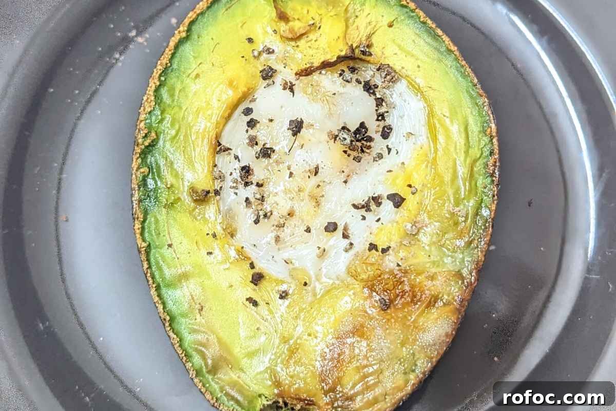 Crispy Air Fryer Avocado Eggs: Quick Breakfast Recipe 2 Avocado egg on a plate