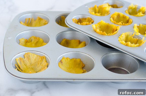 Crispy Dried Pineapple Flowers: Step-by-Step Guide 7 pineapple slices in cupcake pan