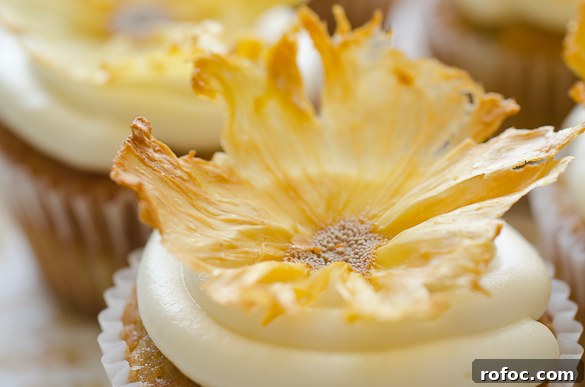 Crispy Dried Pineapple Flowers: Step-by-Step Guide 8 cupcake topped with dried pineapple flower