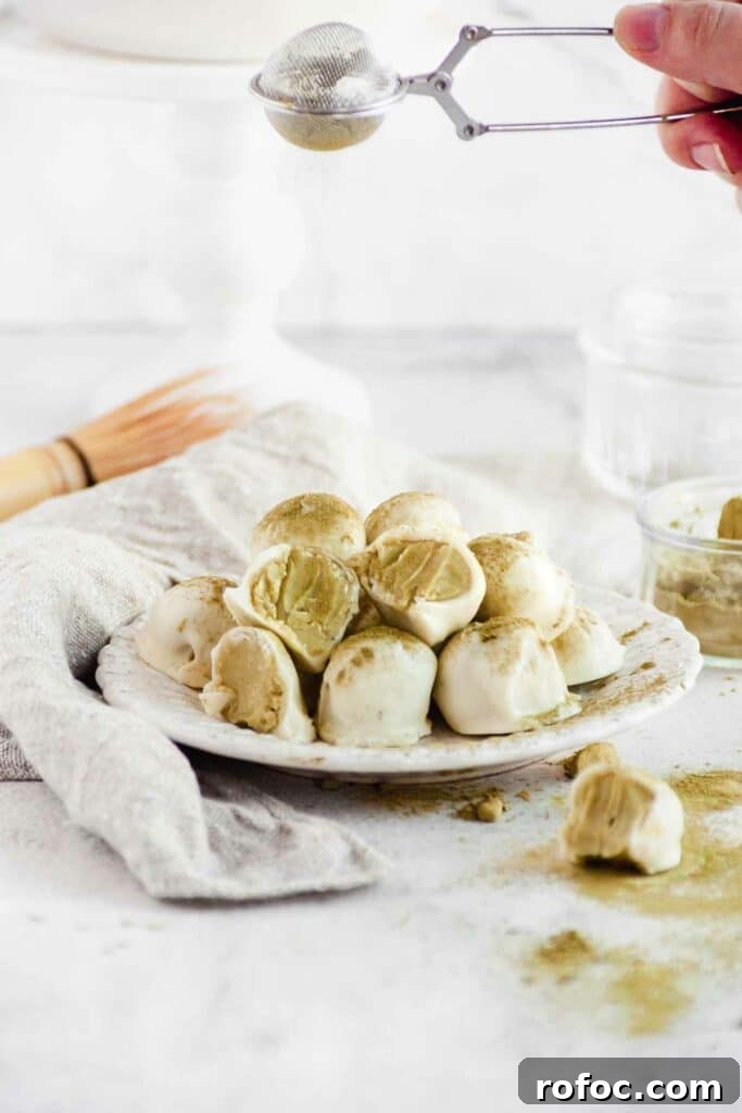 Matcha White Chocolate Ganache Truffles Recipe for Homemade Treats 2 sprinkling matcha powder on prepared matcha truffles