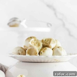 Matcha White Chocolate Ganache Truffles Recipe for Homemade Treats 6 bitten matcha truffles on a plate