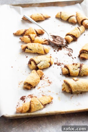 Decadent Nutella Rugelach Recipe: Flaky Chocolate-Filled Pastries 2 Nutella and rugelach on a sheet pan