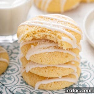 Stack of pound cake cookies on a napkin, with a bite taken from the top cookie.