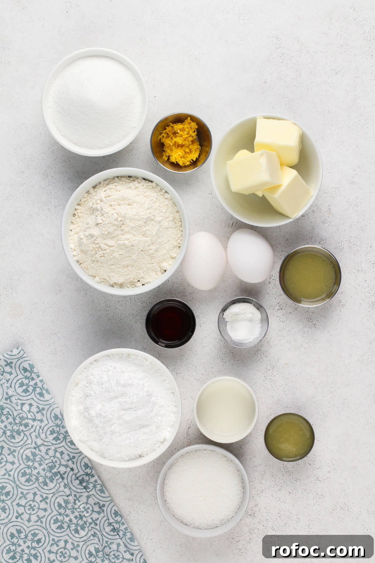 Ingredients for pound cake cookies arranged on a light countertop.