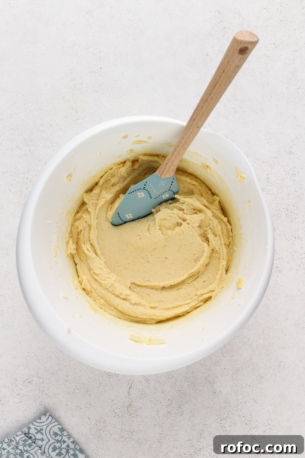 Pound cake cookie dough in a white mixing bowl.
