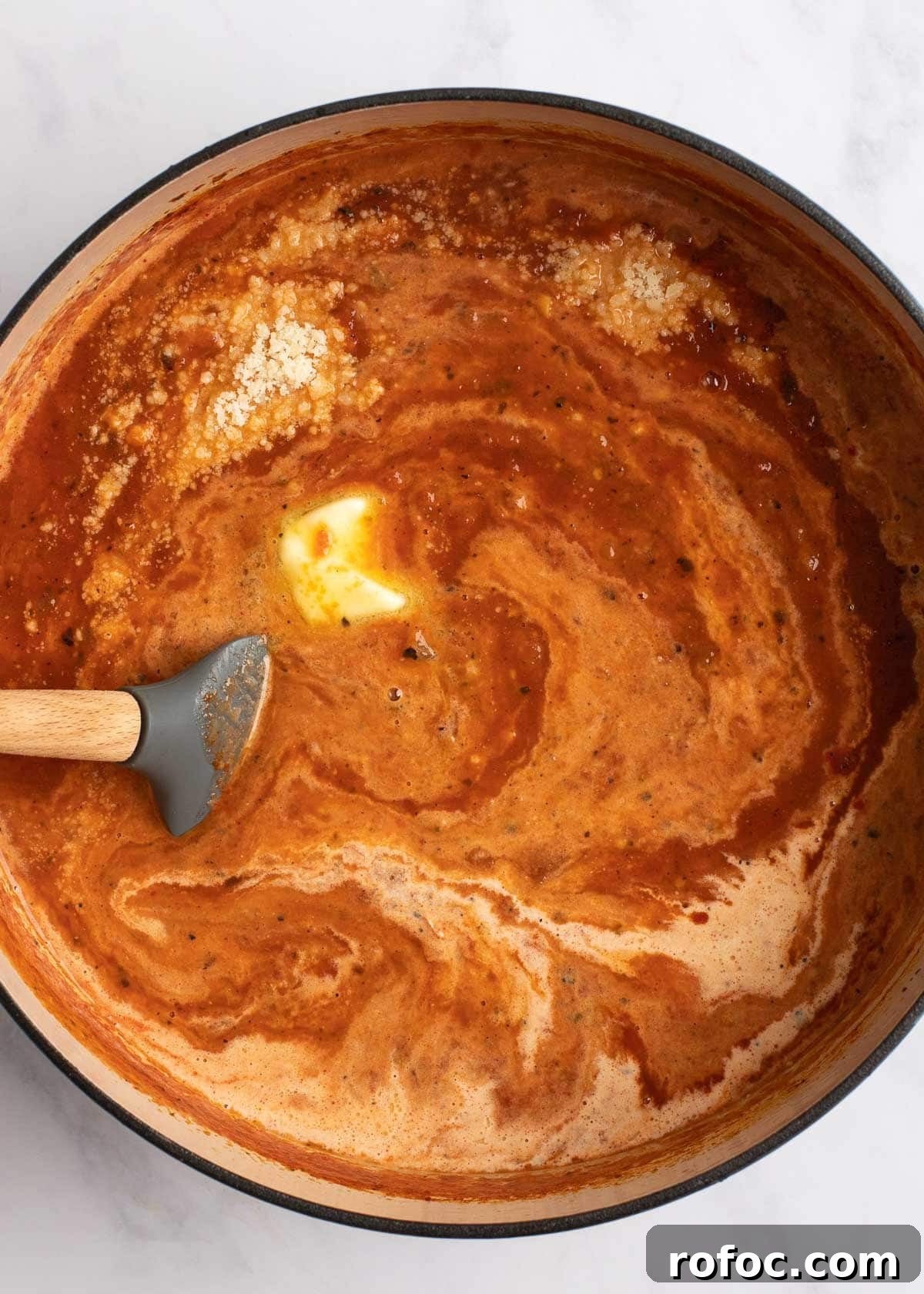 Simple Homemade Tomato Soup Recipe for Rich Flavor 7 an overhead stir shot of creamy tomato soup