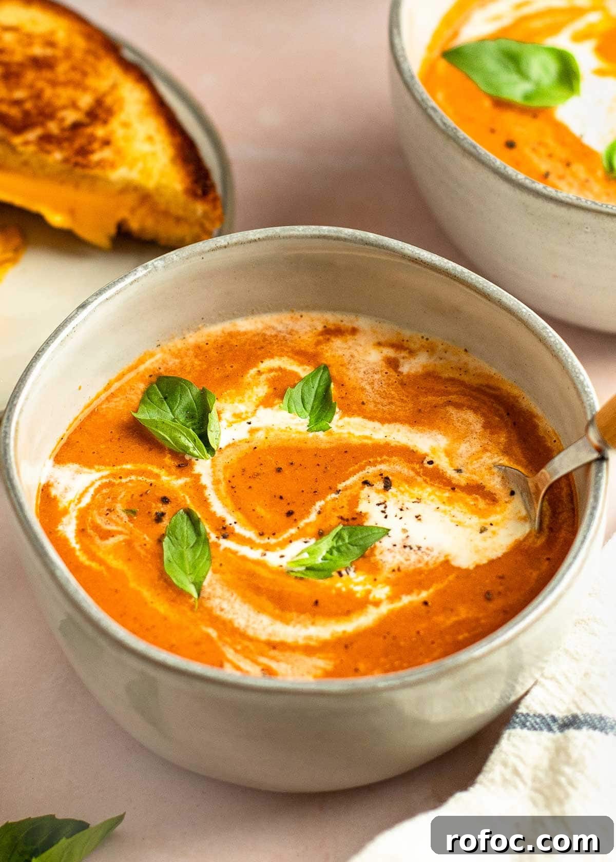 Simple Homemade Tomato Soup Recipe for Rich Flavor 10 tomato soup in bowl with cream and basil