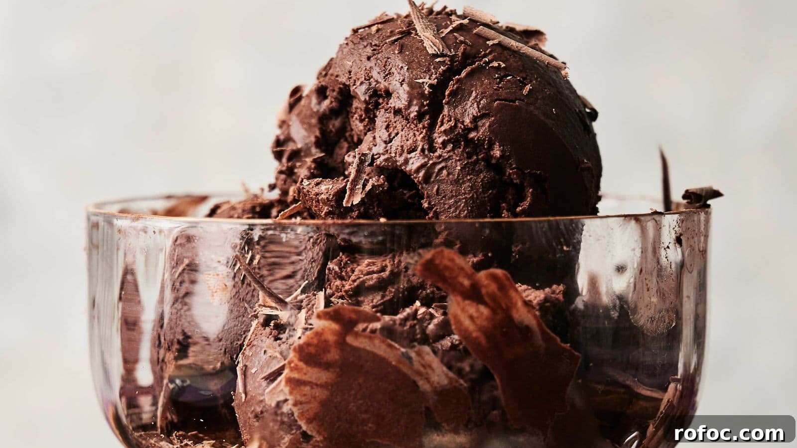 35 Gameday Recipes That Always Crowd-Pleasers Love 8 A glass bowl filled with scoops of dark chocolate ice cream topped with chocolate shavings.