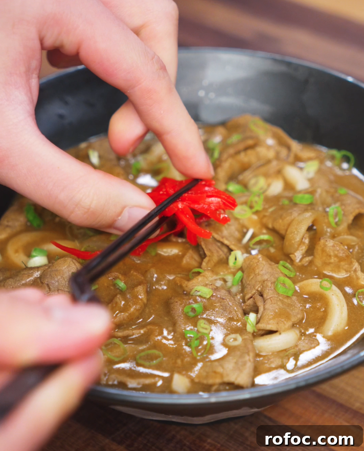 Savory Beef Curry Udon Recipe for Comforting Weeknight Meals 10 Pickled ginger garnish on curry udon.