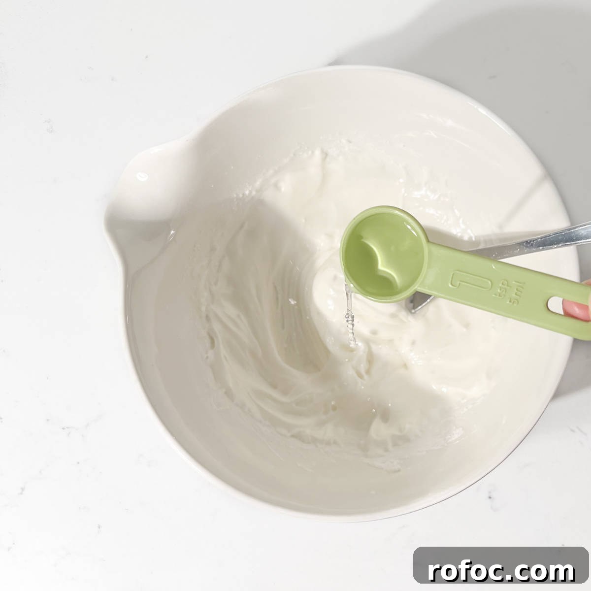 Christmas Cookies Decorated with Edible Wafer Paper (Photo Cookies) 5 Adding a teaspoon of water to the royal icing.