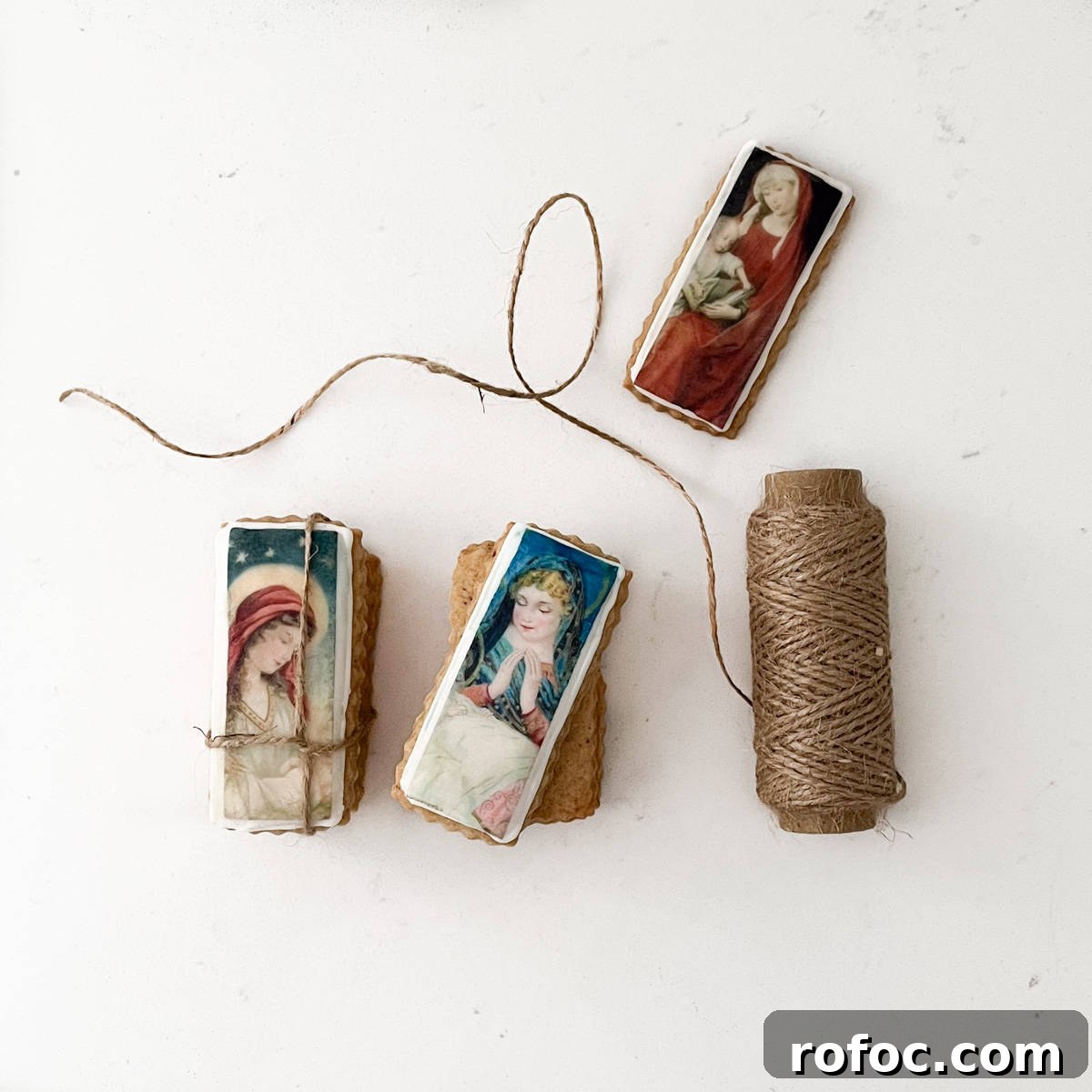 Christmas Cookies Decorated with Edible Wafer Paper (Photo Cookies) 7 A pile of Christmas cookies with edible wafer paper tied together with a piece of string.