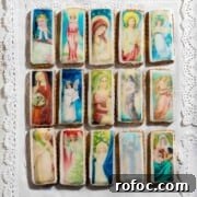 Christmas Cookies Decorated with Edible Wafer Paper (Photo Cookies) 8 Christmas cookies with edible wafer on an embroidered tablecloth.