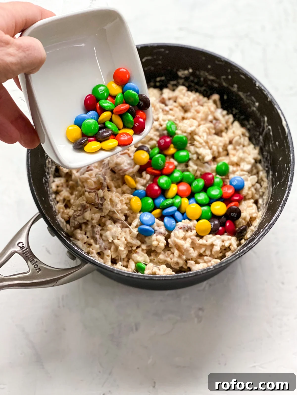 M&M Rice Krispie Treats Recipe: Chewy, Chocolate-Packed Squares 11 adding M&M's