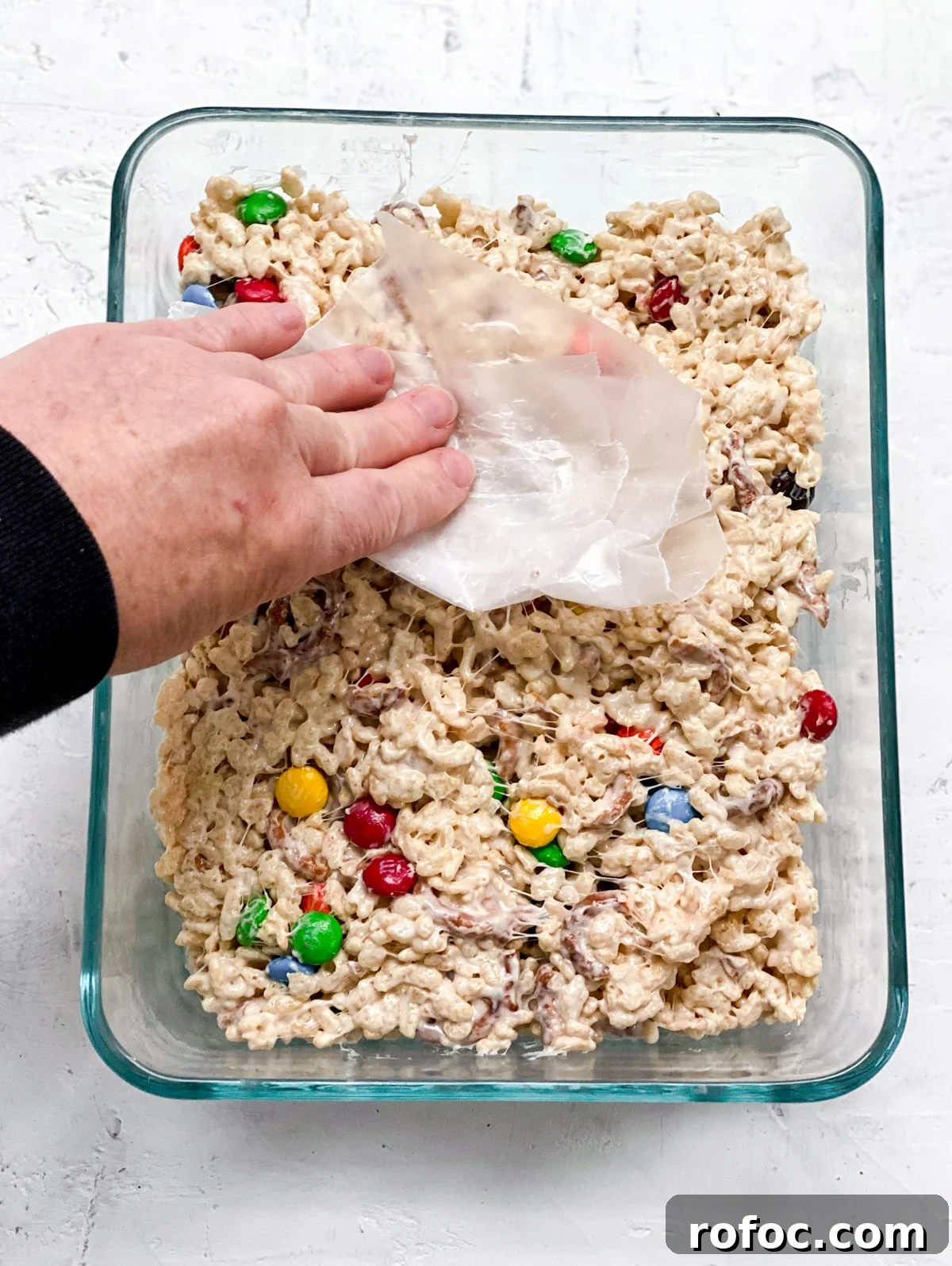 M&M Rice Krispie Treats Recipe: Chewy, Chocolate-Packed Squares 12 pressing down with wax paper