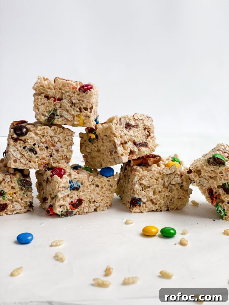 M&M Rice Krispie Treats Recipe: Chewy, Chocolate-Packed Squares 15 M&M rice krispie treats stacked on top of each other
