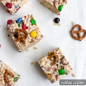 M&M Rice Krispie Treats Recipe: Chewy, Chocolate-Packed Squares 17 M&M rice Krispie treats cut into squares.