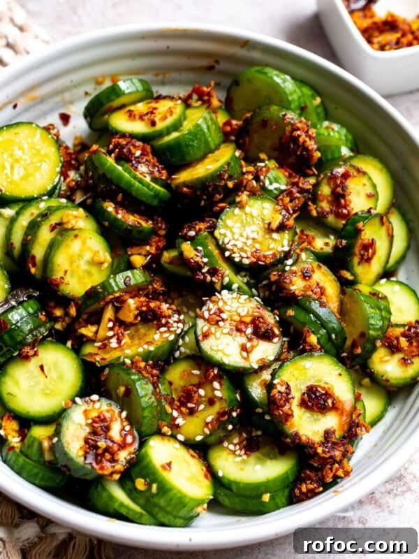 Lemon Honey Orzo with Feta and Fresh Herbs 10 Spicy Cucumber Salad in a white ceramic bowl with spicy crunch.