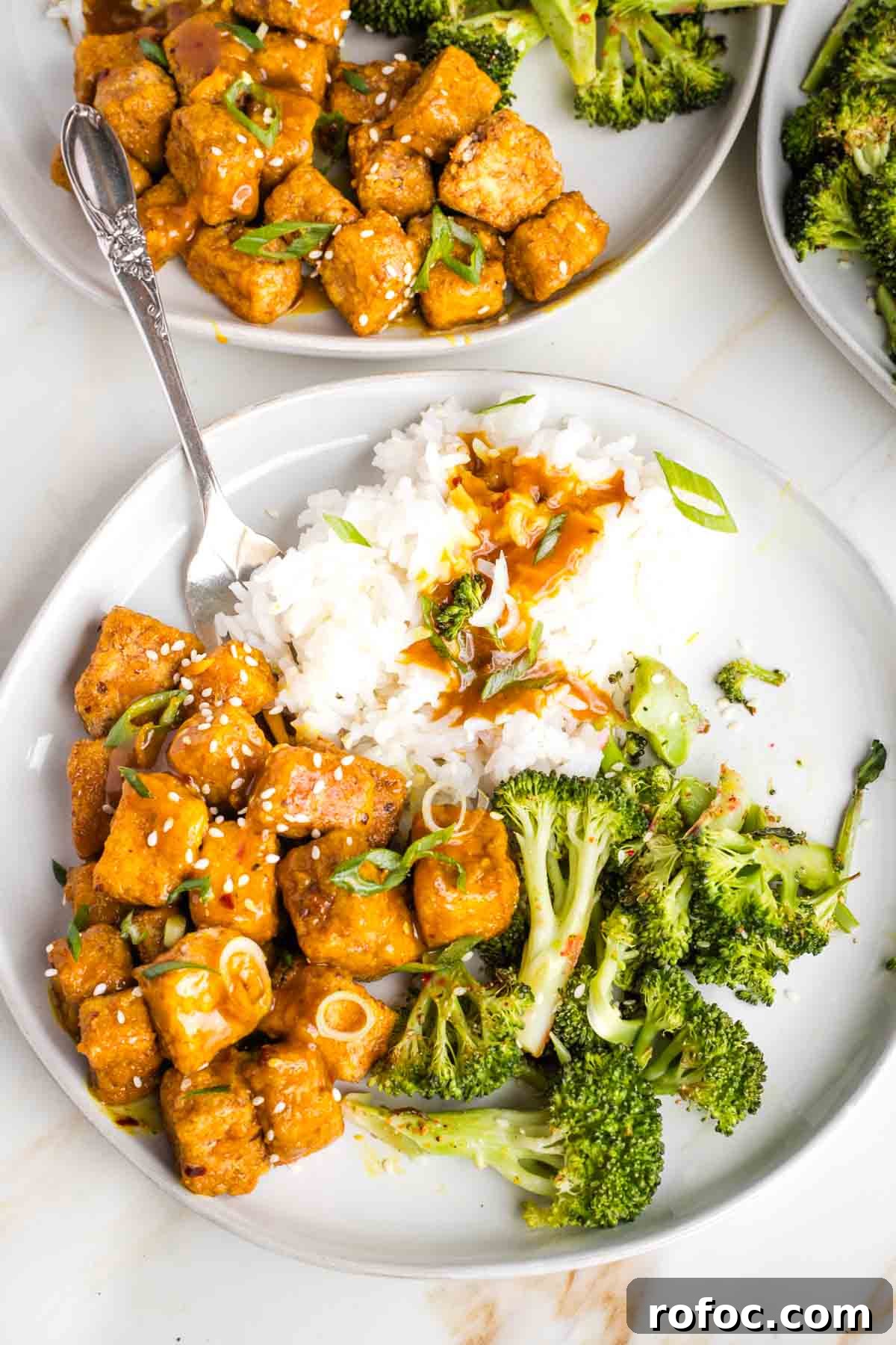 Crispy Orange Tofu — Restaurant-Style Takeout at Home 2 Plate of orange tofu, white rice and roasted broccoli.