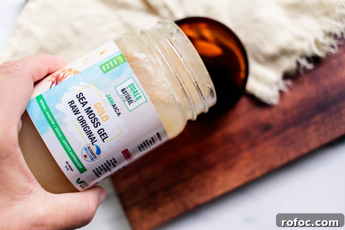DIY Gel Sea Moss Face Mask Recipe for Glowing Skin 6 Adding sea moss to the container.