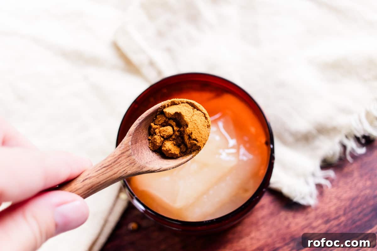DIY Gel Sea Moss Face Mask Recipe for Glowing Skin 7 Adding turmeric to the container.