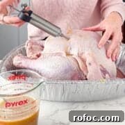 Savory Turkey Injection Recipe for Juicy, Flavorful Roasts 11 Injecting the turkey with the seasoning.