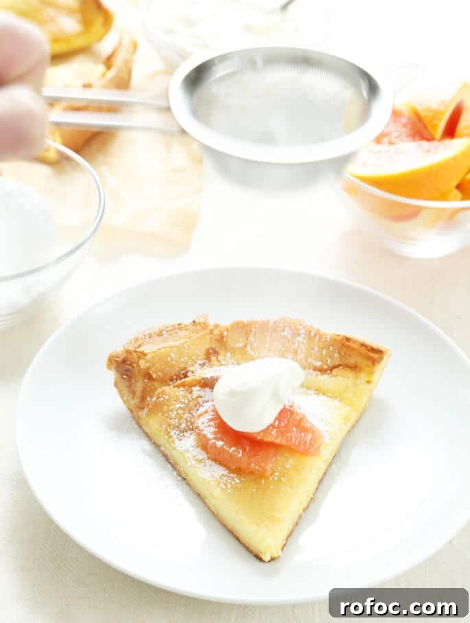 Gluten-Free Dutch Baby Pancake Recipe for Fluffy Morning Brunch 2 Large gluten free dutch baby pastry on a white plate