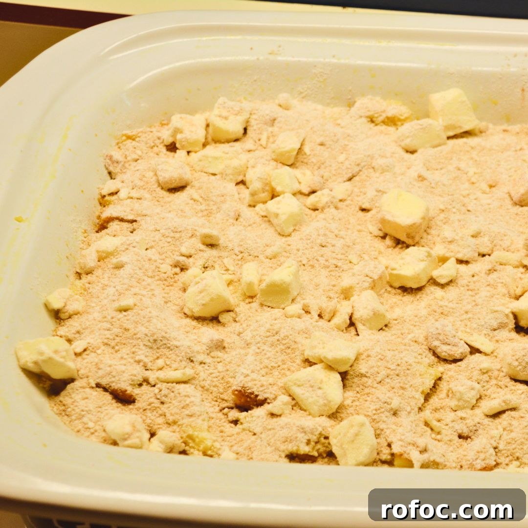 Overnight Baked French Toast Casserole with Maple Glaze 6 Crumb topping ready to be added over the soaked bread.