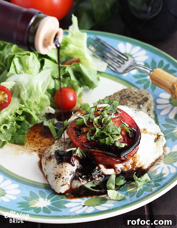 Caprese-Style Baked Catfish Fillets with Tomato and Mozzarella 2 drizzling balsamic vinegar over a baked catfish fillet