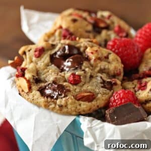 Raspberry, Almond & Chocolate Chunk Cookies: Soft, Chewy Treats 2 Close up of Raspberry Almond Chocolate Chunk Cookies in a light blue ceramic container.