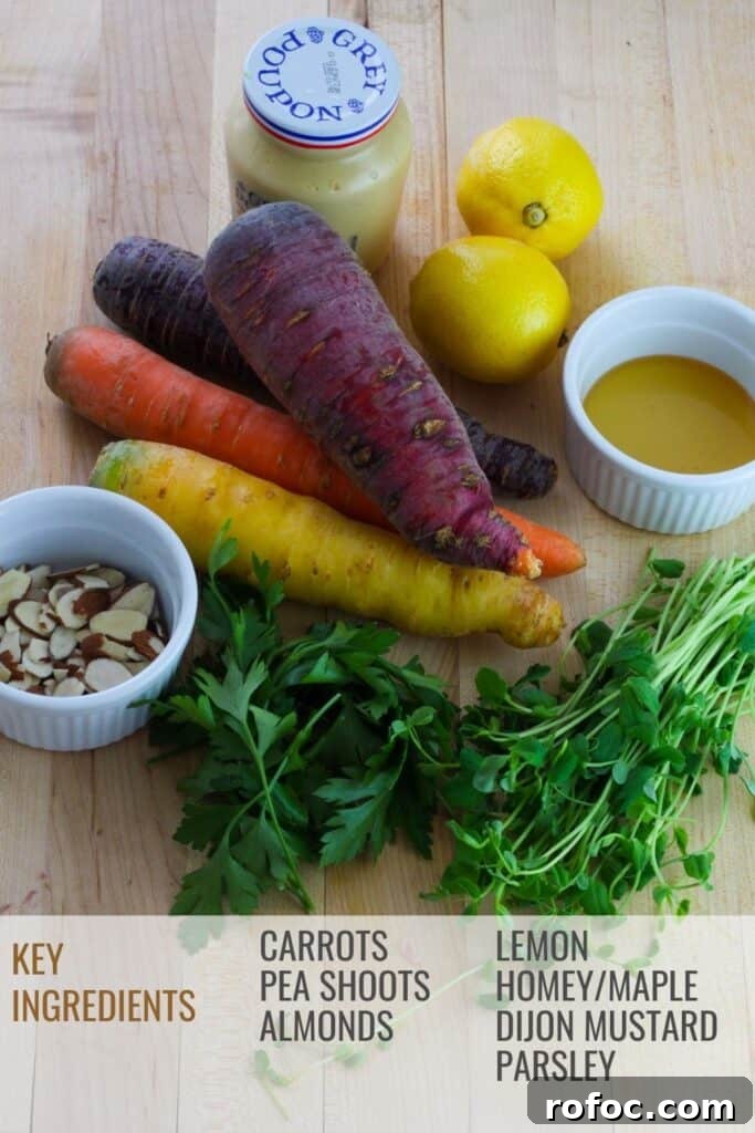 Spring Carrot and Pea Shoot Salad with Lemon Vinaigrette 3 Overhead shot of multicolored whole carrots , lemons, mustard, honey, pea shoots, parsley and a small white bowl with sliced almonds all on a butcher block cutting board.