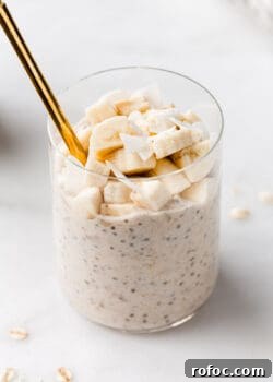 banana overnight oats in a cup with a gold spoon