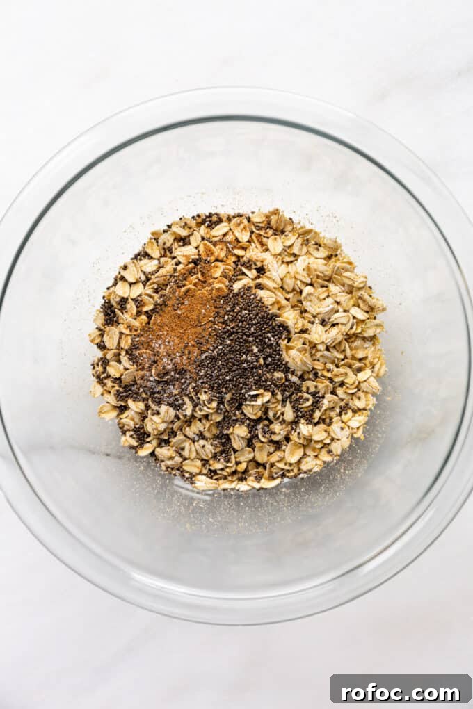 Banana Cream Pie Overnight Oats Recipe for Creamy Make-Ahead Breakfast 4 oats, chia seeds and nutmeg in a mixing bowl