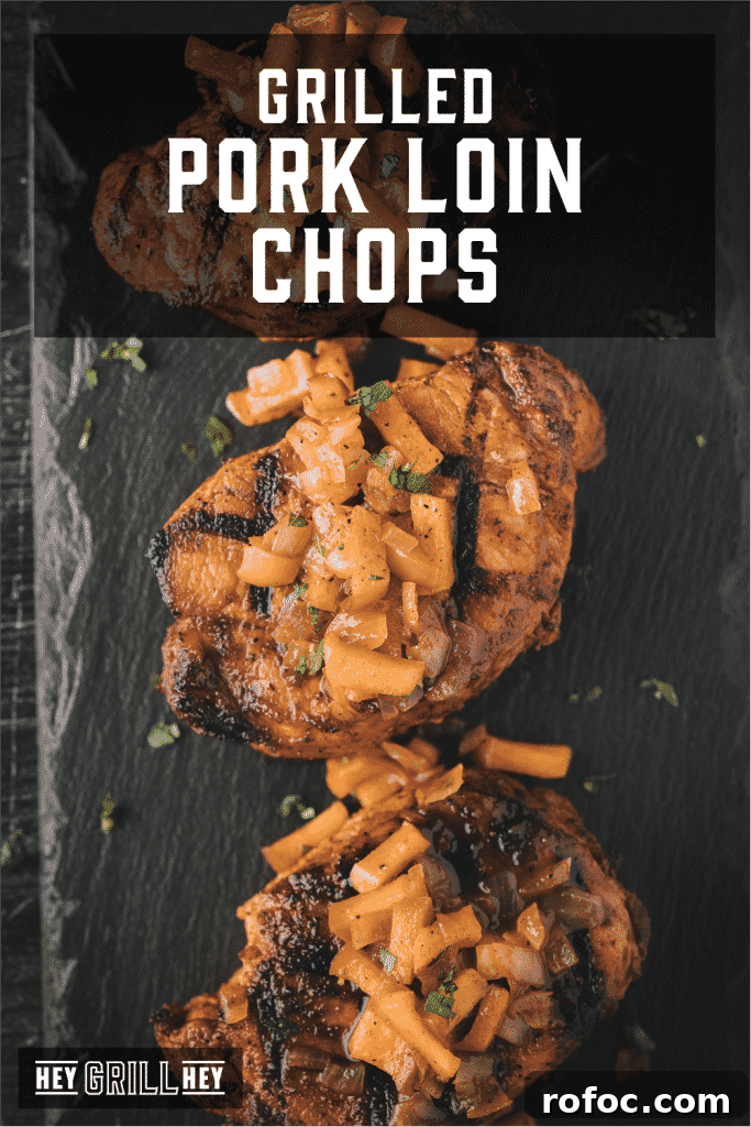 Grilled Pork Loin Chops with Caramelized Apples & Onions Recipe 2 Three grilled pork loin chops topped with grilled apples and onions with text overlay - Grilled Pork Loin Chops.