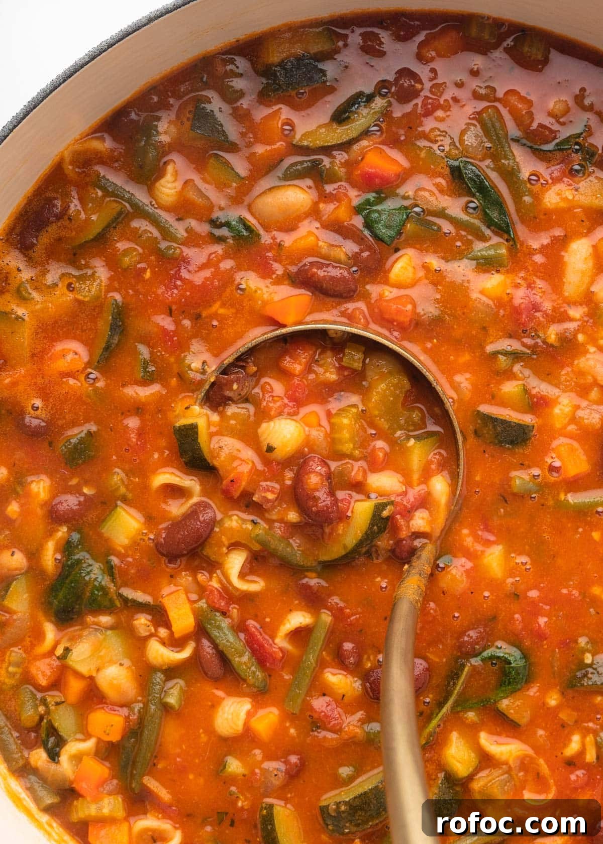 Classic Italian Minestrone Soup Recipe for Cozy Weeknight Dinners 16 closeup overhead of minestrone soup being ladled from a pot