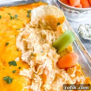 Creamy Buffalo Chicken Dip Made with Canned Chicken 11 Buffalo chicken dip with canned chicken recipe with carrots and celery in the dip.
