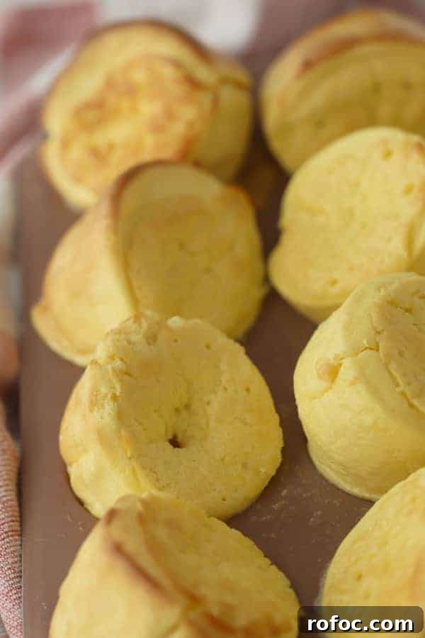 Fluffy German Pancake (Dutch Baby) Recipe + Video Guide 6 Dutch babies in a muffin tin, just out of the oven.
