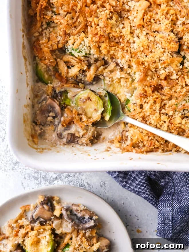 Classic Herb Stuffing Recipe for Holiday Roasts 10 scooping brussels sprout and mushroom casserole out of baking dish