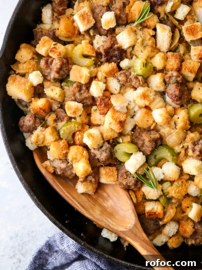 Classic Herb Stuffing Recipe for Holiday Roasts 7 spoon in skillet stovetop sausage stuffing close-up