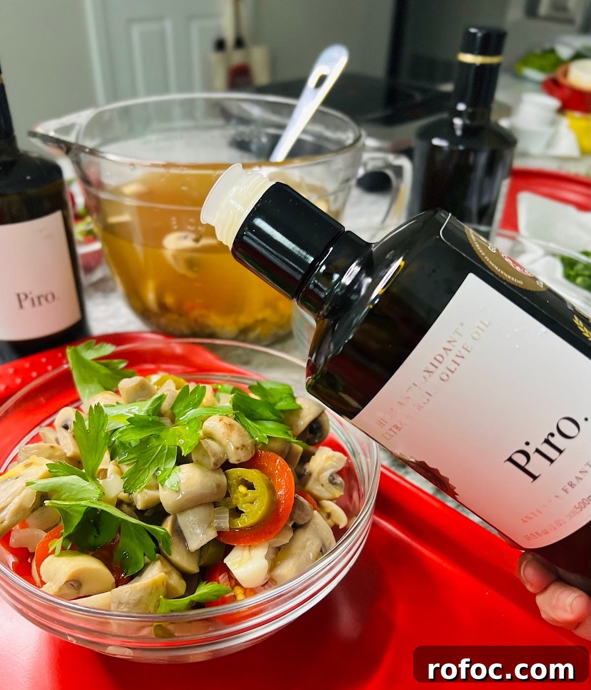 Spicy Marinated Italian Deli Mushrooms — Pickled Mushroom Recipe 18 Spicy Italian Marinated Mushrooms Finished and Styled in Jar with Bottle