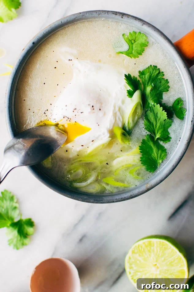 Sipping Broth with Poached Egg — Paleo, Dairy-Free & Vegan Option 2 Simple sipping broth with a poached egg! Your perfect go-to healthy pick-me-up // fridge clean out meal when you need a little extra something in your life. Made with high quality broth, fresh herbs, coconut milk and a poached egg this little pot is gauranteed to having you feeling fine in no time!