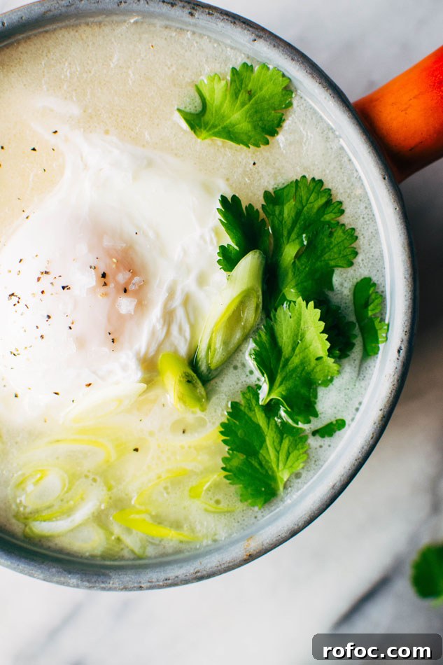 Sipping Broth with Poached Egg — Paleo, Dairy-Free & Vegan Option 3 Simple sipping broth with a poached egg! Your perfect go-to healthy pick-me-up // fridge clean out meal when you need a little extra something in your life. Made with high quality broth, fresh herbs, coconut milk and a poached egg this little pot is gauranteed to having you feeling fine in no time!