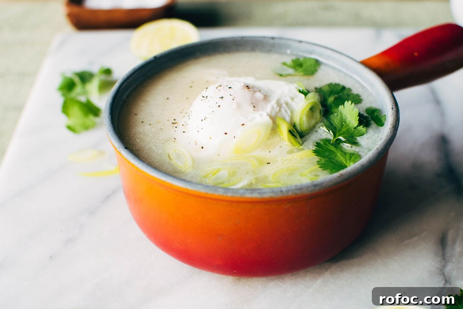 Sipping Broth with Poached Egg — Paleo, Dairy-Free & Vegan Option 5 Simple sipping broth with a poached egg! Your perfect go-to healthy pick-me-up // fridge clean out meal when you need a little extra something in your life. Made with high quality broth, fresh herbs, coconut milk and a poached egg this little pot is gauranteed to having you feeling fine in no time!