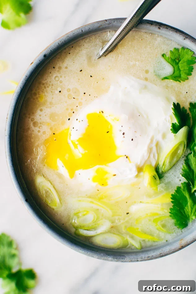 Sipping Broth with Poached Egg — Paleo, Dairy-Free & Vegan Option 6 Simple sipping broth with a poached egg! Your perfect go-to healthy pick-me-up // fridge clean out meal when you need a little extra something in your life. Made with high quality broth, fresh herbs, coconut milk and a poached egg this little pot is gauranteed to having you feeling fine in no time!