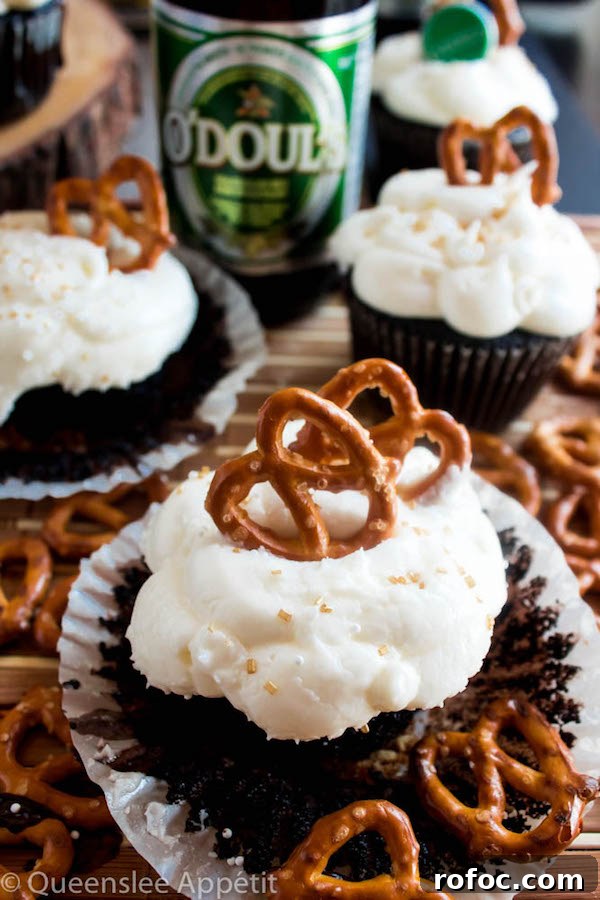Savory Beer & Pretzel Cupcakes: Unexpected Party Dessert 9 Finished Beer and Pretzel Cupcakes decorated with sprinkles and pretzels