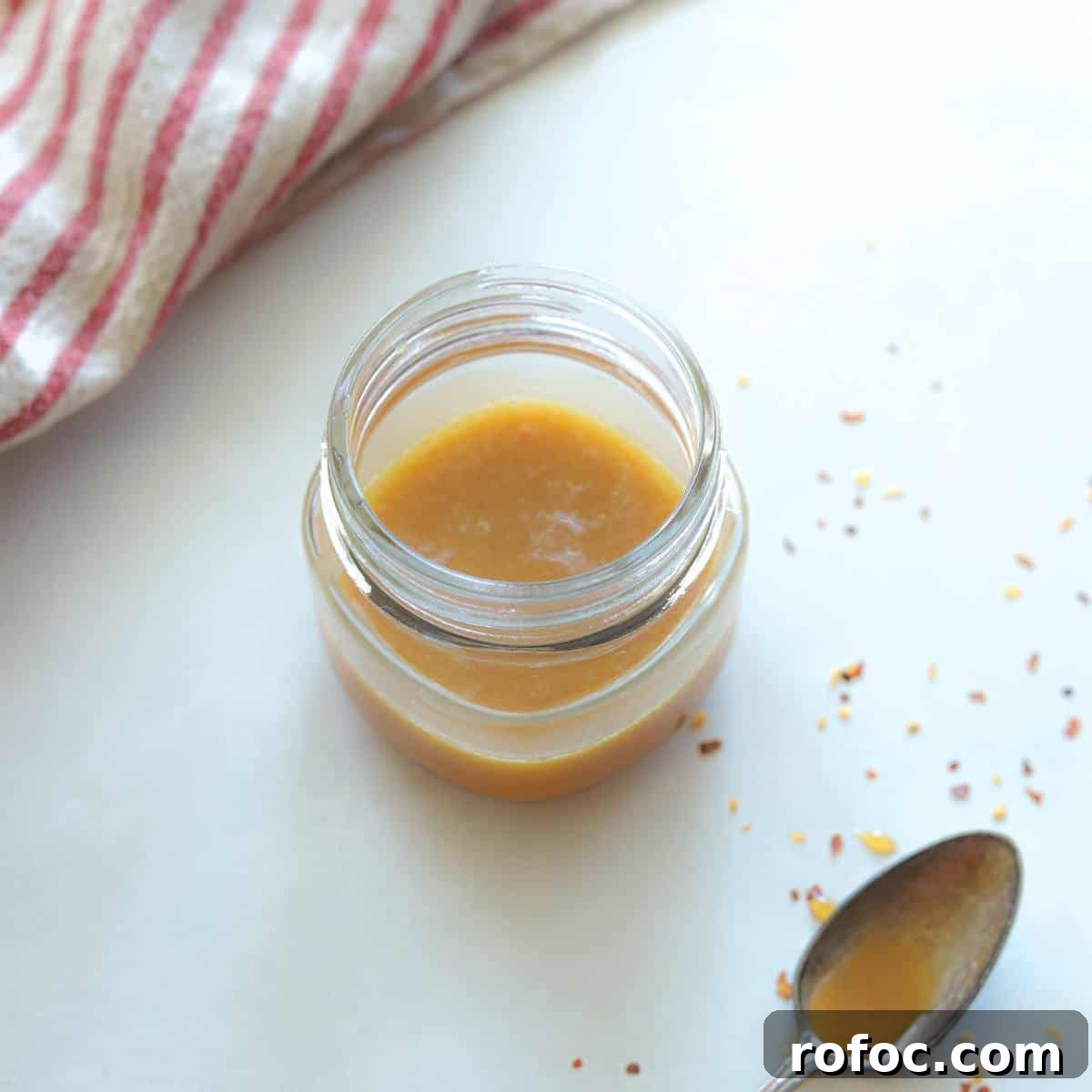 Sweet Heat Honey Mustard Sauce Recipe 2 jar full of spicy honey mustard with spoon on the side