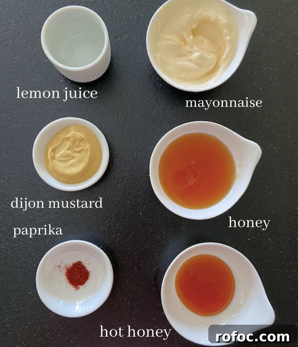 Sweet Heat Honey Mustard Sauce Recipe 3 Ingredients for hot honey mustard on black countertop