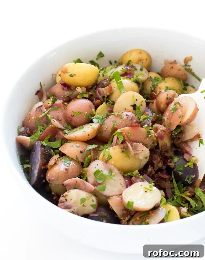 Warm German Potato Salad | chefsavvy.com Warm German Potato Salad in large white bowl