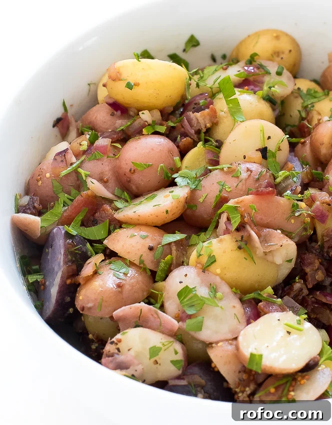 Authentic German Potato Salad | chefsavvy.com Authentic German Potato Salad in large white bowl